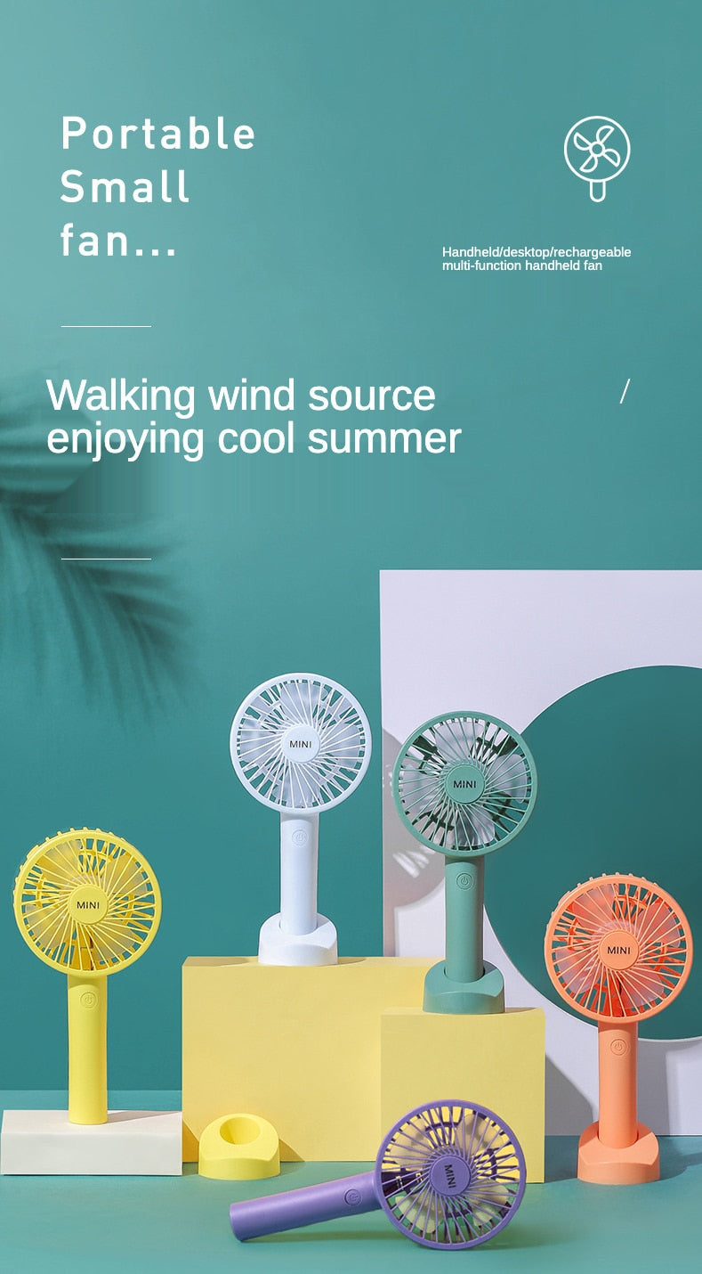 Portable mini fan Students hold a small fan desktop and hold a USB small fan
